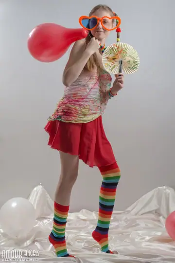 Slim Woman in Rainbow Socks Spreads Her Hairy Pussy