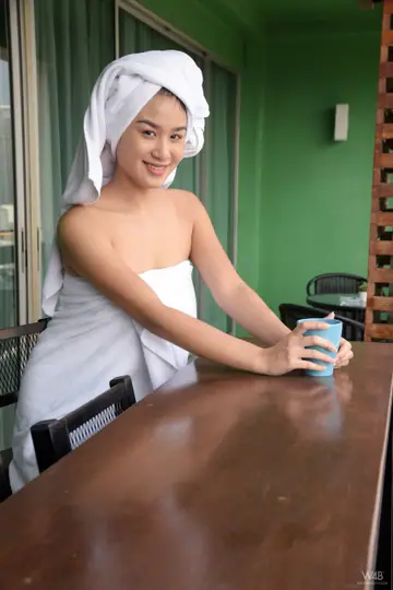 Kahlisa Boonyasak – Asian Brunette Oils Her Natural Tits and Hairy Pussy in the Kitchen