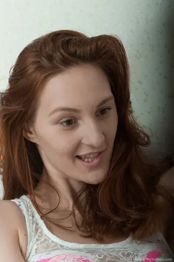 Pale Redhead in Lingerie and Socks Spreads Her Hairy Pussy