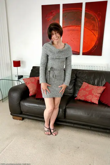 Slim Short-Haired Mature Woman Spreads Her Hairy Pussy