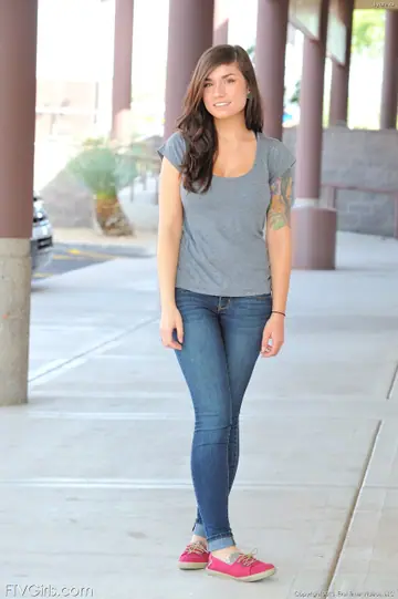 Brunette Shows Her Big Tits and Tattoos in Jeans Outdoors