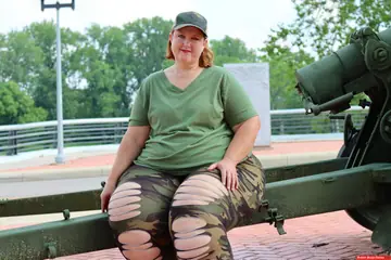 Mature PAWG Poses Outdoors on an Artillery Gun
