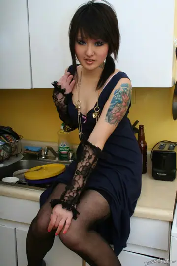 Asian Woman Gives a Blowjob and Spreads in the Kitchen