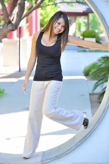 Annie Lee – Thai Brunette in a Skirt and Heels Reveals Her Big Tits and Pussy