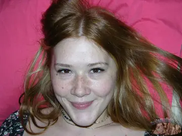 Redhead Spreads Her Trimmed Pussy on the Bed