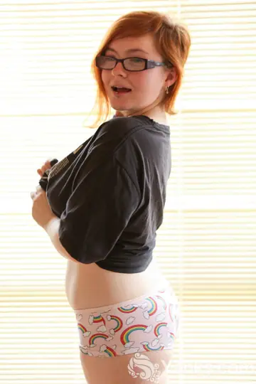Chubby Redhead in Glasses Fingers Her Hairy Pussy