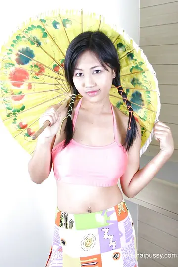 Asian Woman with Pigtails Shows Her Hairy Pussy and Uses a Dildo