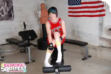 Sabrina Squirts – Tattooed Brunette Squirts in Socks on a Weightlifting Bench