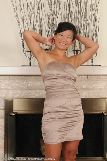 Mature Asian Brunette Lifts Her Skirt and Spreads Her Shaved Pussy