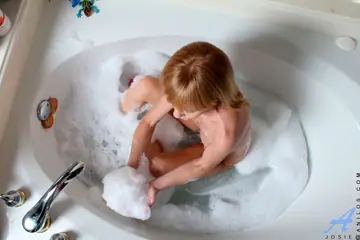 Busty Redhead MILF Toys Her Pussy and Fucks in the Bathroom
