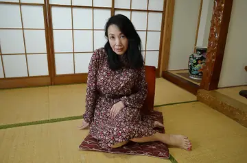 Mature Asian Woman in Lingerie Pulls Panties Aside to Spread Her Hairy Pussy