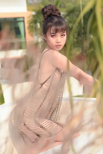 Petite Thai Woman Undresses Outdoors