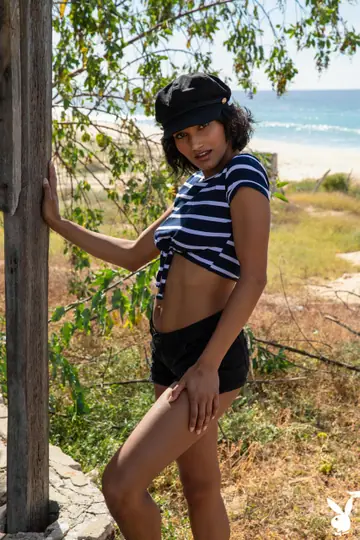 Angel Constance – Short-Haired Brunette Flashes Her Body on the Beach