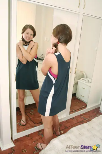 Woman in Lingerie and Pigtails Strips Naked in Front of a Mirror