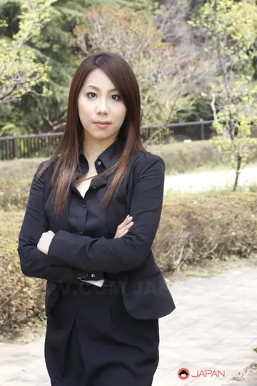Asian Brunette Adjusts Her Skirt and Glasses Outdoors