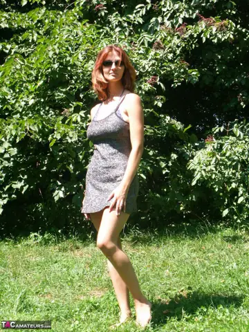 Redhead MILF Strips Out of Her Bikini and Skirt Under a Tree