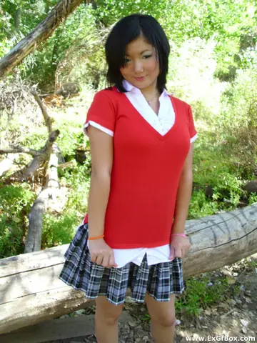 Slim Asian Woman Strips Nude and Poses Outdoors