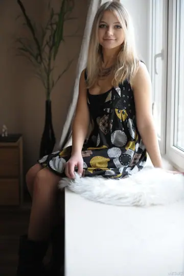 Blonde Removes Her Boots to Show Her Hairy Pussy in a Dress and Stockings