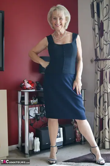 Michelle Nylons – Mature British Blonde Strips Off Her Dress and Fingers in Stockings