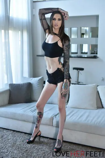 Rocky Emerson – Tall Tattooed Brunette Gives a Footjob in High Heels