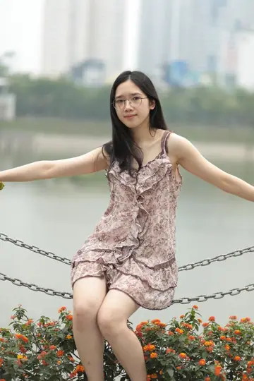 Petite Asian Woman Lifts Her Short Dress Outdoors