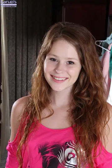 Redhead Spreads Her Shaved Pussy Lips