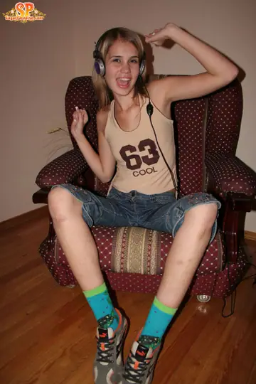 Blonde with Small Natural Tits Strips Down to Her Socks and Spreads