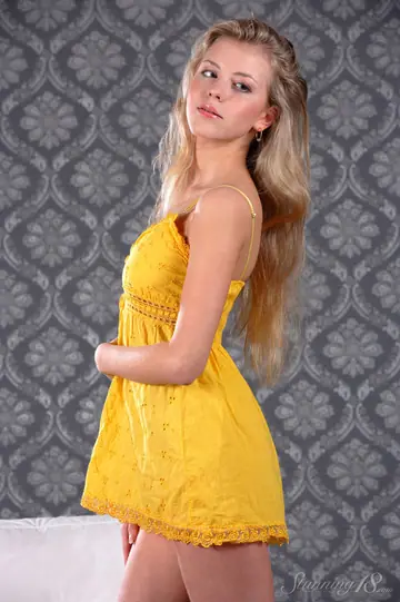 European Blonde Strips Off Her Yellow Dress and Spreads Her Shaved Pussy