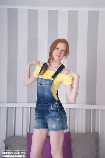 Skinny Redhead Strips Naked and Spreads Her Shaved Pussy