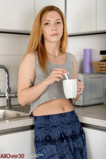 Sata Jones – Redhead MILF Strips Naked for Her Kitchen Debut