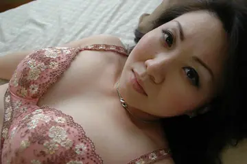 Asian MILF Sheds Her Lingerie to Reveal Her Hairy Pussy
