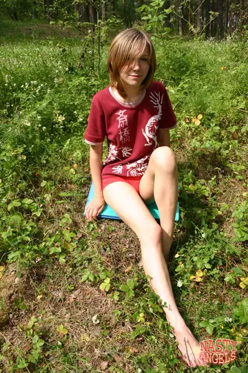 Russian MILF Strips Nude Outdoors in the Forest