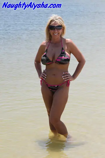 Busty Blonde Masturbates with a Dildo on the Beach