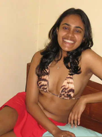 Indian Woman Shows Her Breasts in Lingerie and Skirt on the Bed