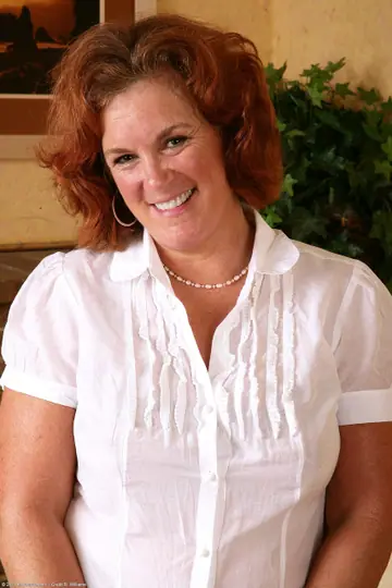 Curvy Redhead MILF Strips Out of Her Pantyhose and Fingers Her Hairy Pussy