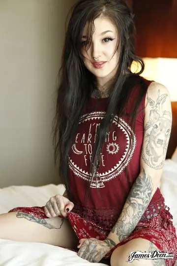 Pale Tattooed Brunette Pulls Panties Aside and Fingers Her Pussy