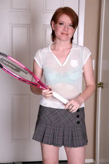 Thick Redhead MILF Strips Out of Her Tennis Skirt to Show Off