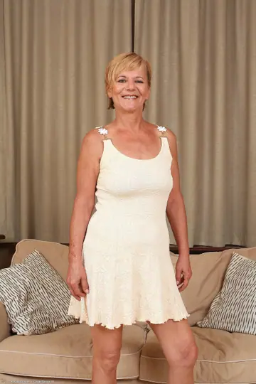 Mature Blonde with Short Hair Strips Nude and Fingers Herself