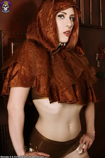 Anastassia Bear – Thick Redhead Poses in Latex Costume and Stockings