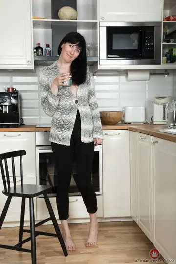 Nimfa Mannay – Tall Pale MILF Strips in the Kitchen and Fingers Her Shaved Pussy