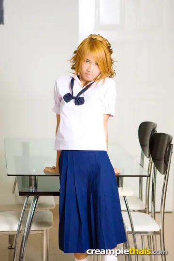 Slim Thai Redhead in Uniform Spreads Her Shaved Pussy