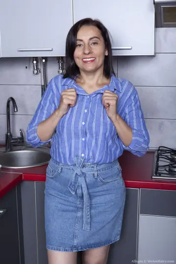 Busty Mature Woman with Short Hair Shows Her Hairy Pussy