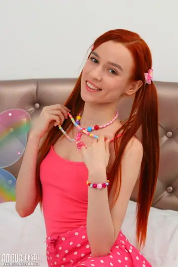 Skinny Redhead in Pigtails Strips and Spreads Her Pussy