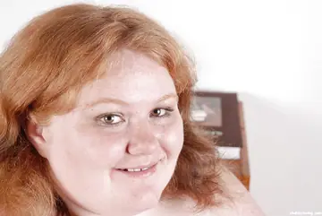 Mature BBW with Big Tits and Piercings Poses Nude