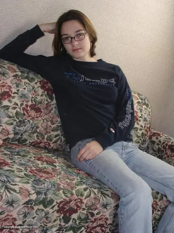 Woman in Glasses Undresses from Jeans and Lingerie