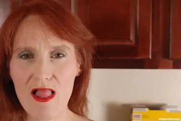 Redhead Granny Fingers Her Shaved Pussy
