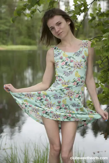Skinny Woman Undresses by the Lake and Fingers Her Pussy
