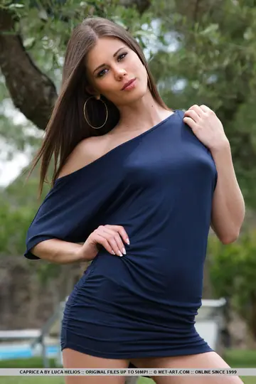 Tall Brunette Lifts Her Skirt Outdoors to Spread Her Hairy Pussy