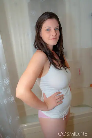Brunette with Big Tits Poses Nude in the Bathroom