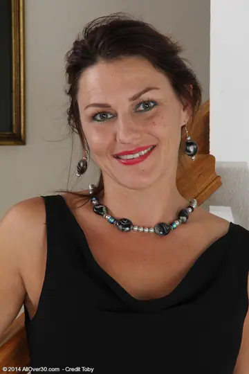 Joana Jakes – Mature Brunette in a Skirt and Thong Spreads Her Hairy Pussy